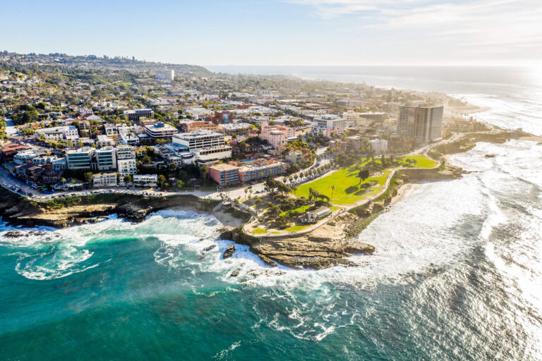 Apartments and condos overlook a curvy shoreline where America's Finest City reaches the Pacific.