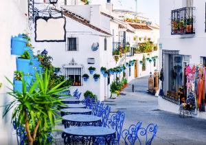 Blue tables at an outdoor cafe in Costa Del Sol, Spain