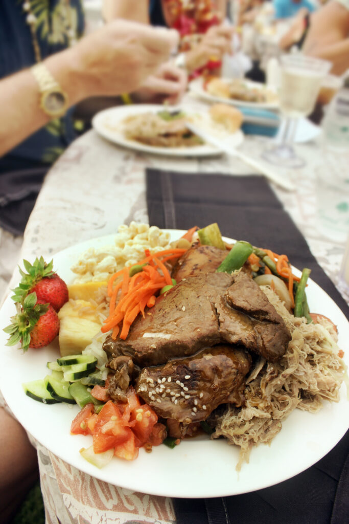 Plate of food at a Hawaiian luau.