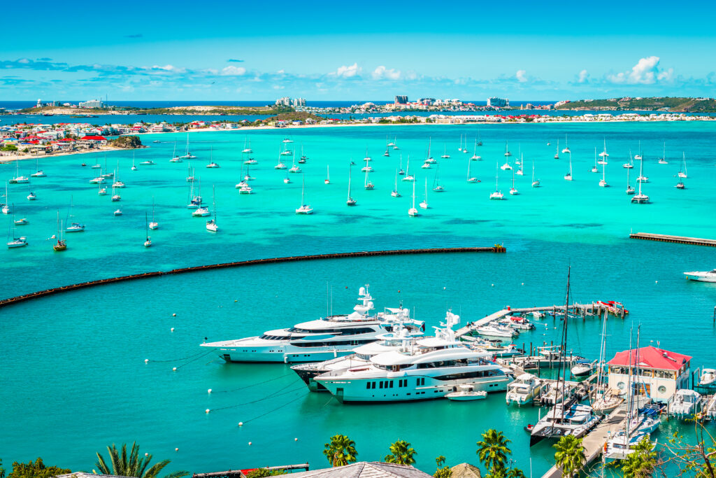 Bright and colorful harbor view with yachts and boats in the marina of Marigot in Saint Martin, French side of the Caribbean Island.